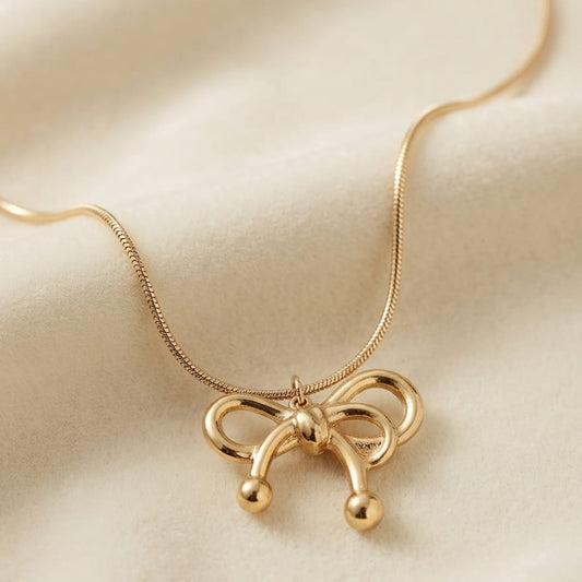 Golden Bow Pendant Necklace – Elegant Ribbon Charm Necklace