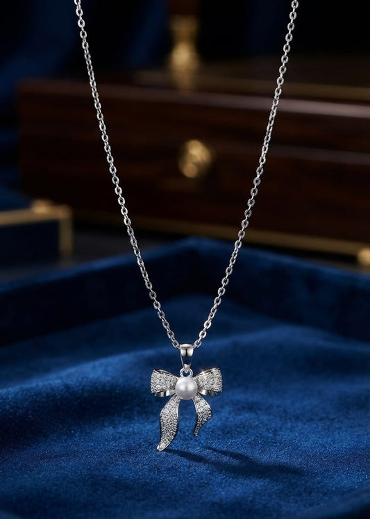 Elegant Silver Bow Pearl Pendant Necklace – Crystal Ribbon Charm for Women